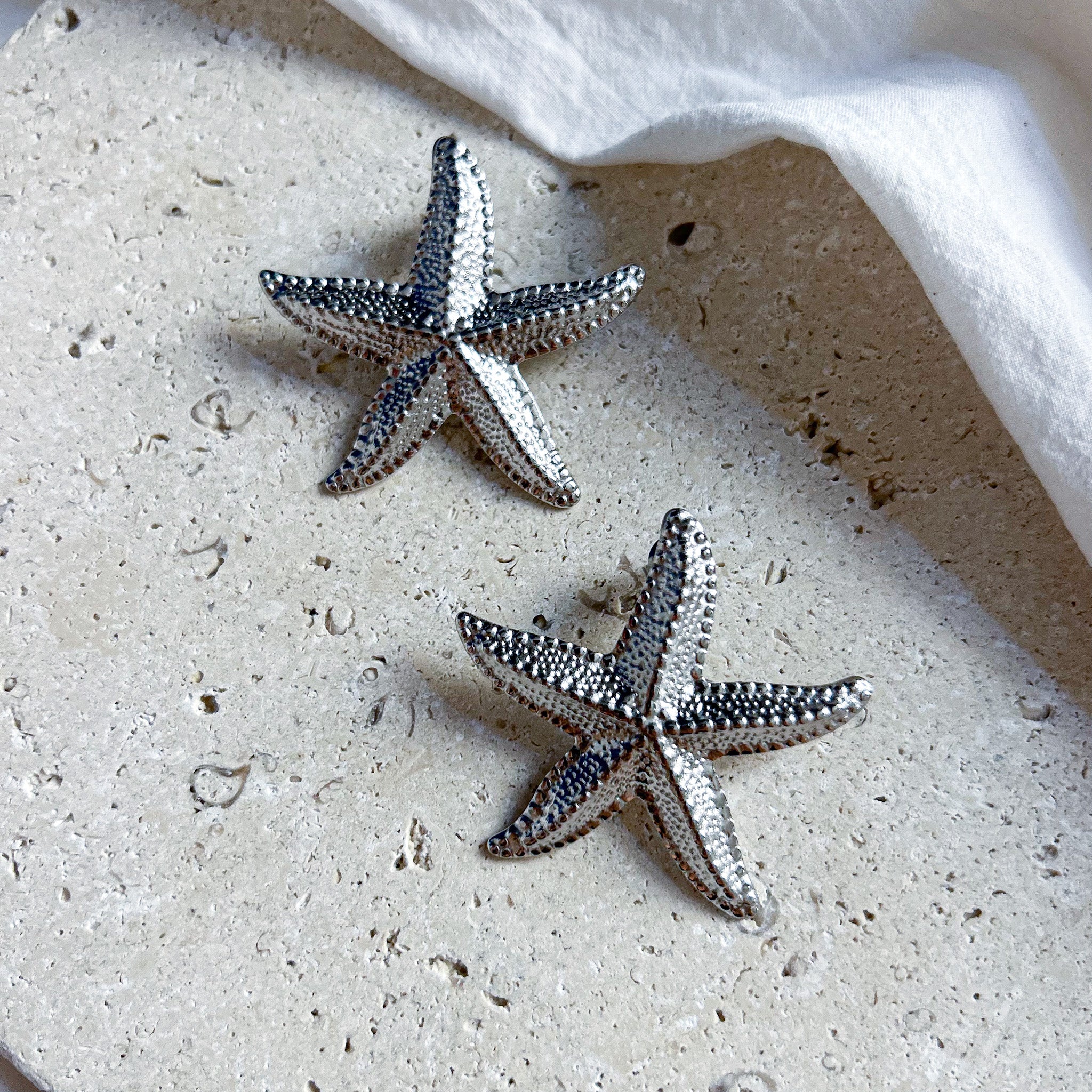 Boucles étoiles de mer argentées