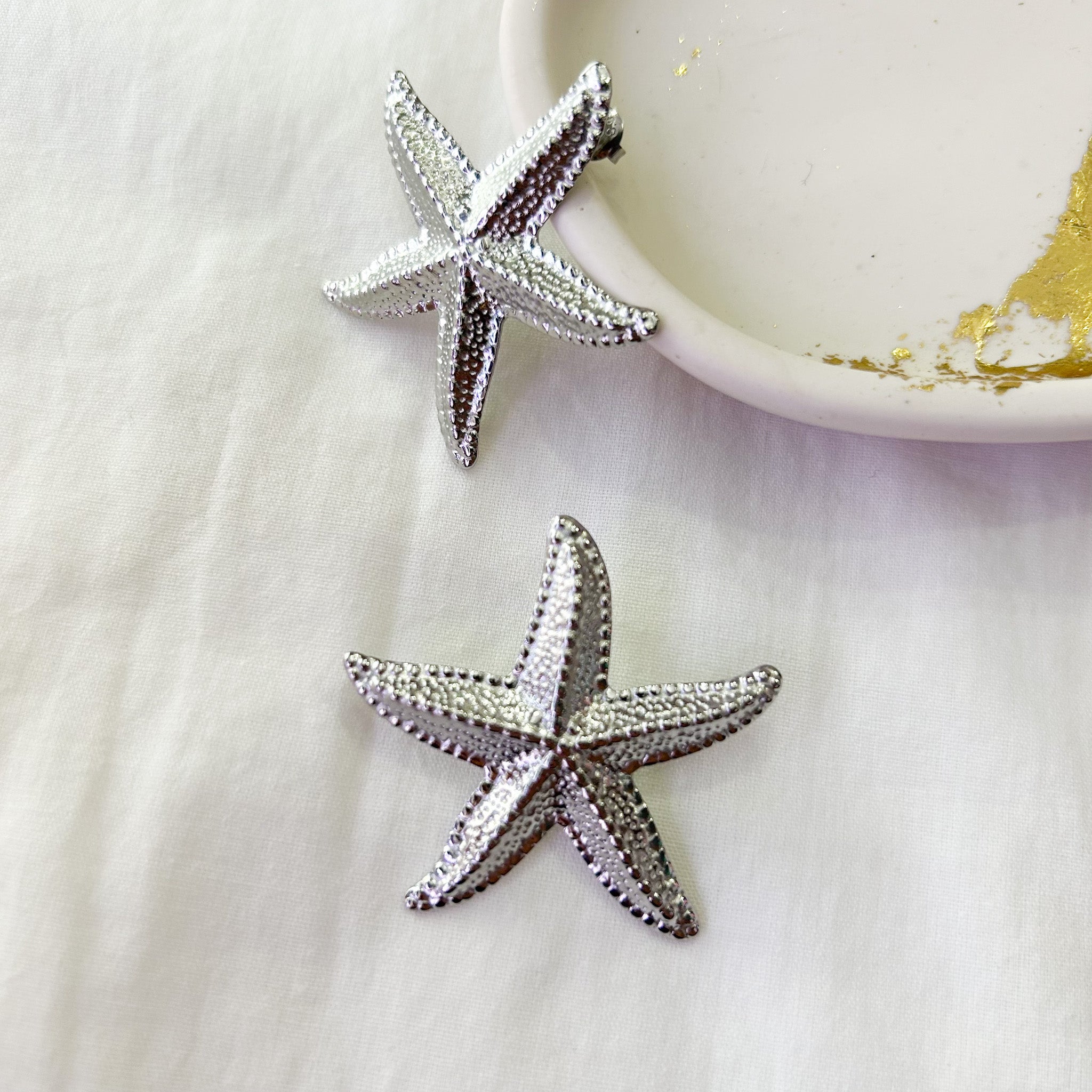 Boucles étoiles de mer argentées