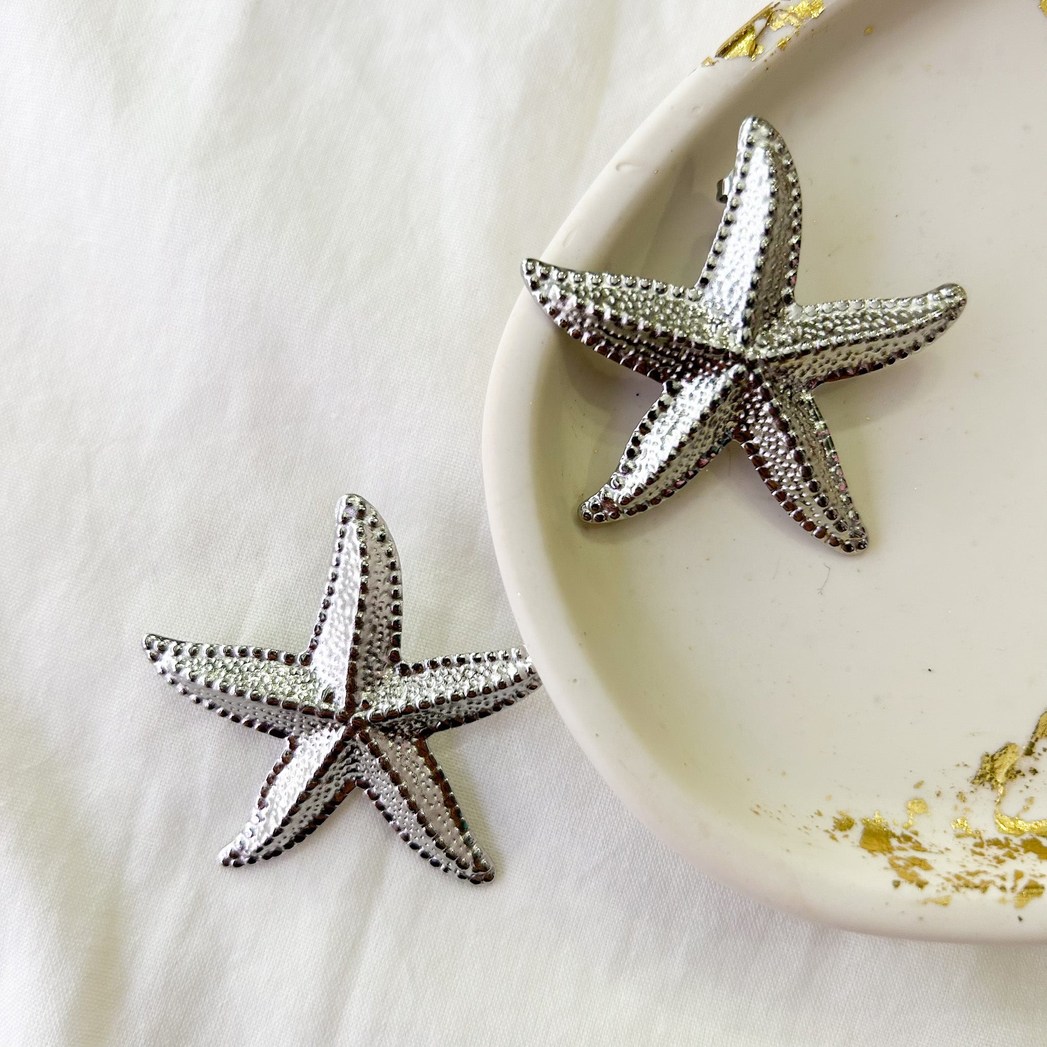 Boucles étoiles de mer argentées