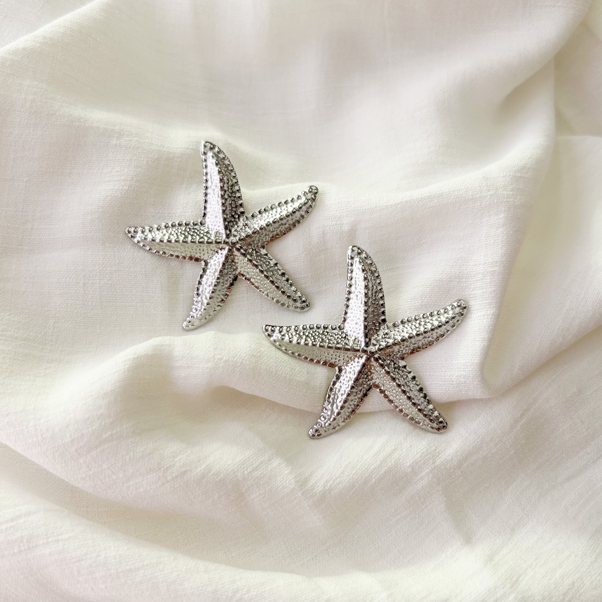 Boucles étoiles de mer argentées