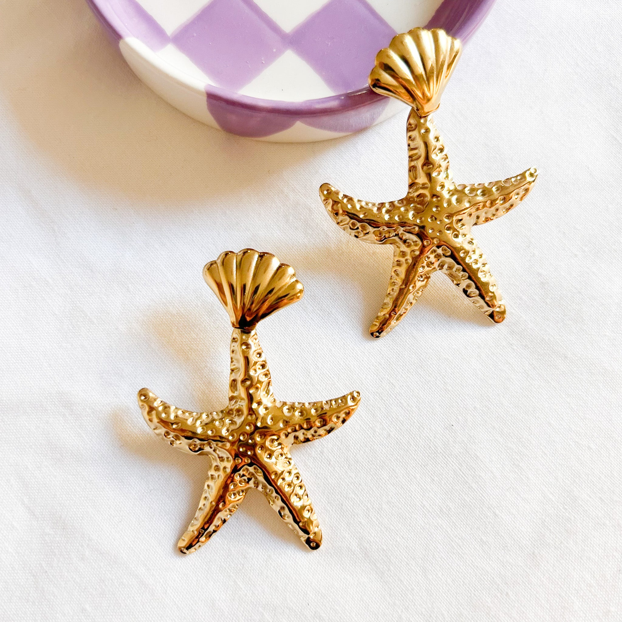 Boucles étoiles de mer dorées