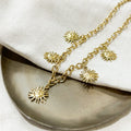 Collier breloques soleils